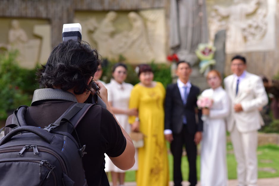 Professional wedding photographer in action